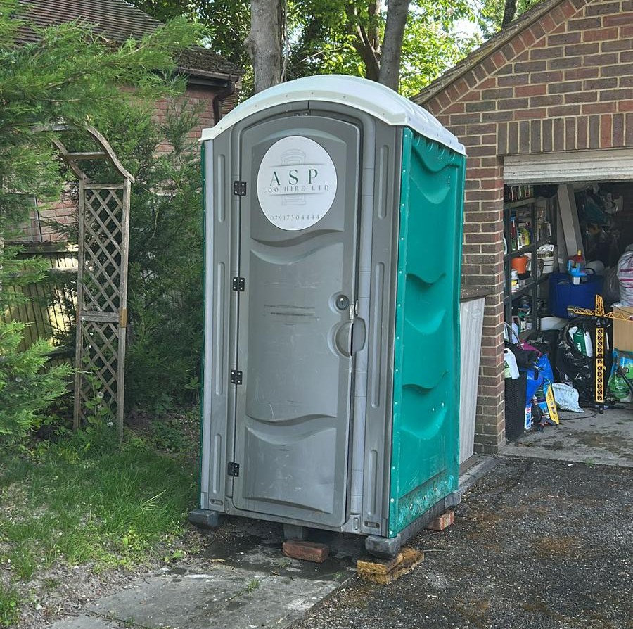 site toilet hire for a domestic renovation.  Green site toilet on site.